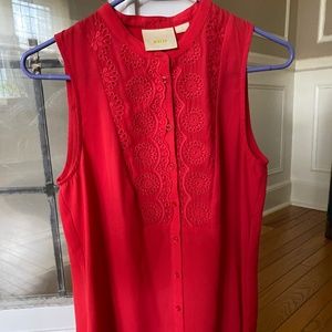 Red sleeveless blouse